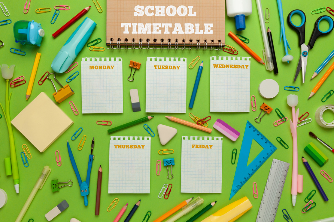 School timetable with stationery on green background. Lesson schedule